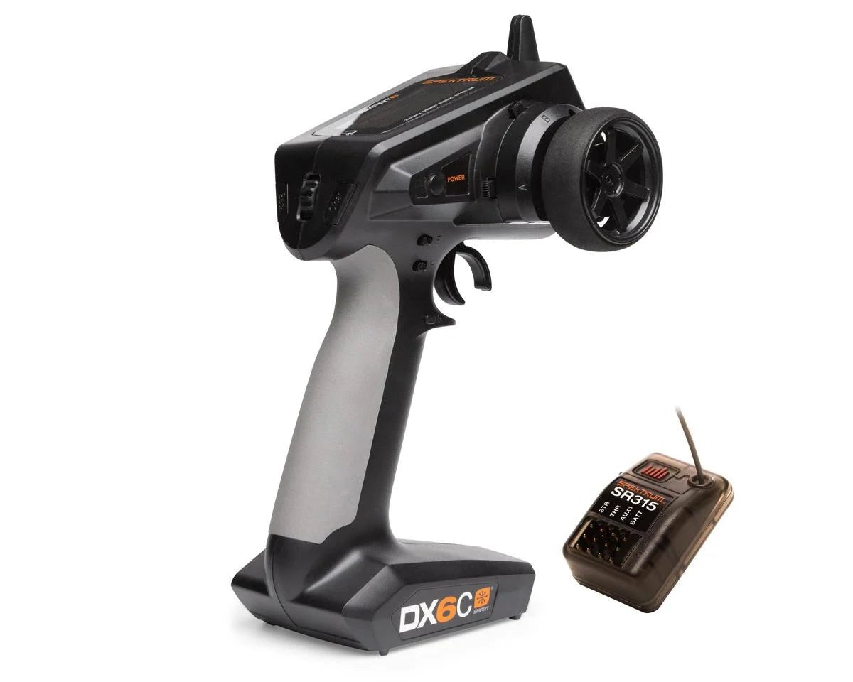 A black Spektrum RC DX6C 6-Channel DSMR Surface Radio with an LCD screen and a USB-C port, alongside a Spektrum SR315 3-Channel DSMR Sport Receiver.